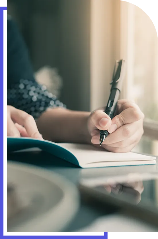 womans hands writing